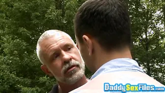 Horny stud fucks mature man in missionary pose in public