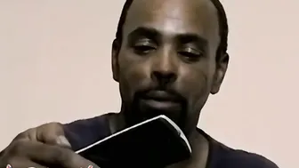 Black thug smokes and works on his massive ebony cock
